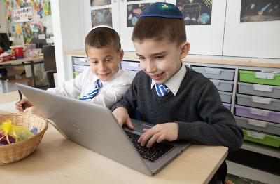 Calderwood Lodge pupils using laptop